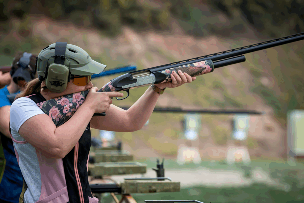  female shooter confidently using a Syren shotgun or handgun designed specifically for women