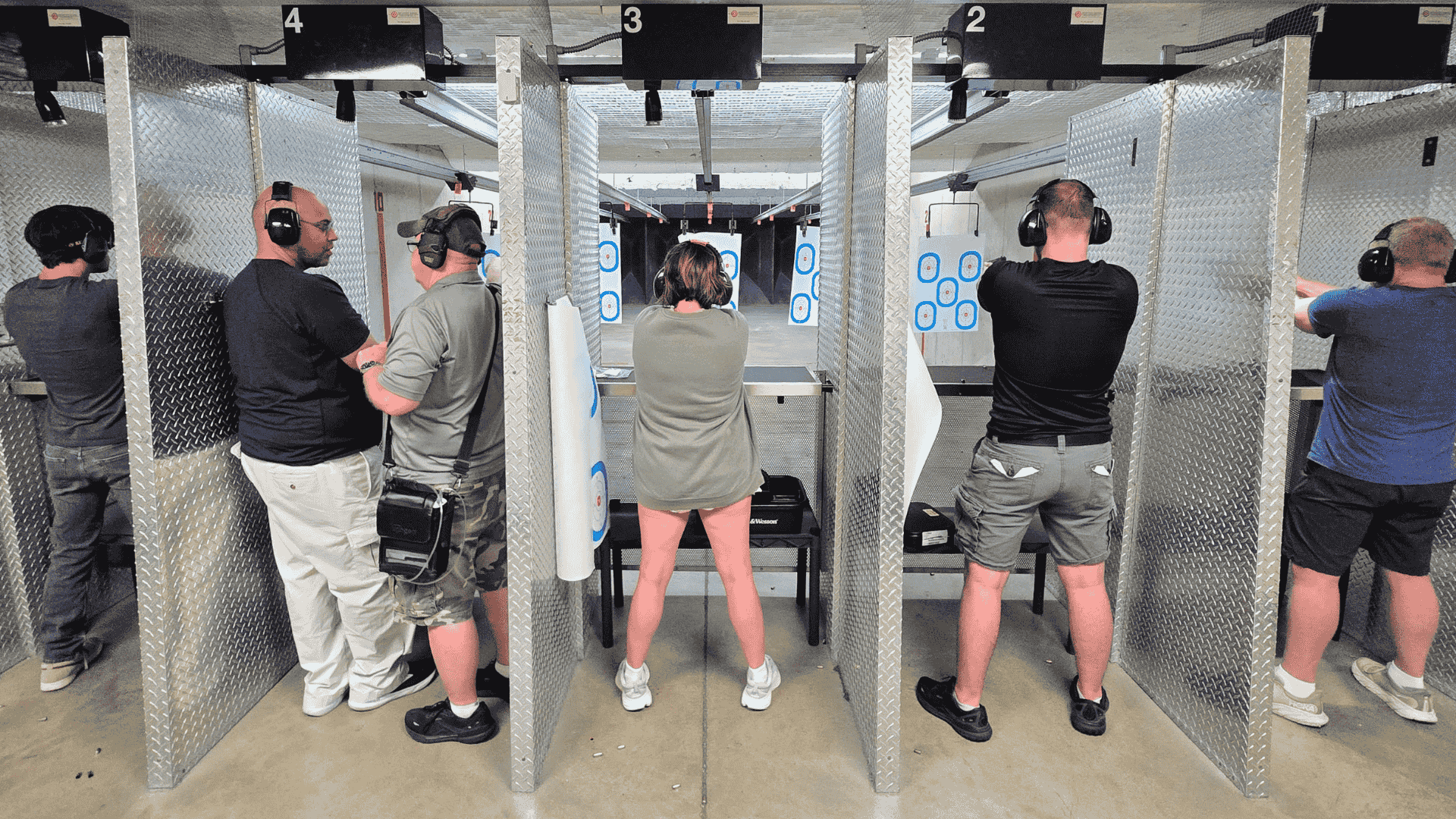 People practicing shooting at targets.